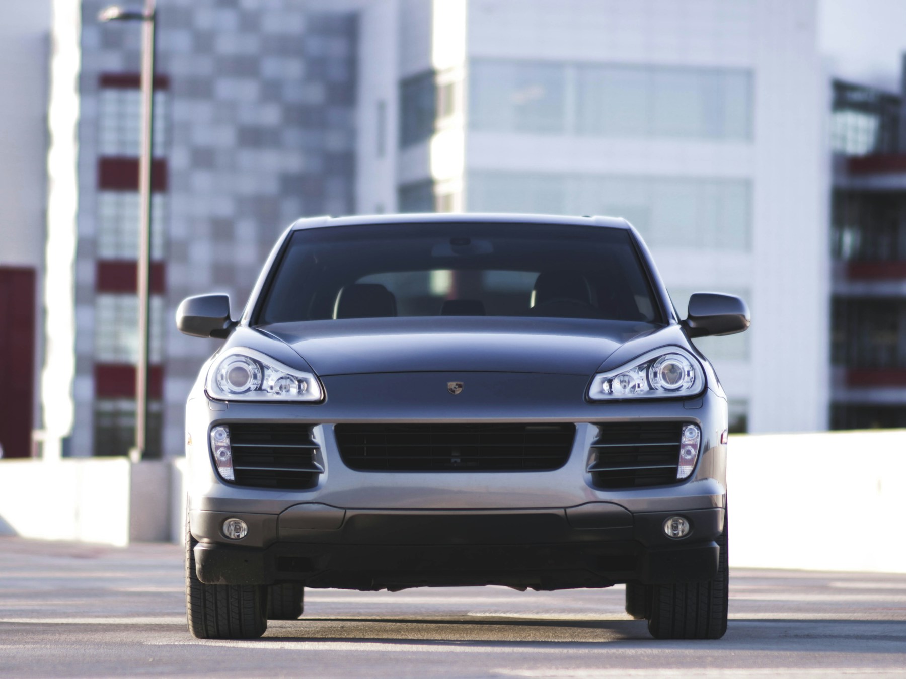 Silver-grey Porsche Macan shown in full